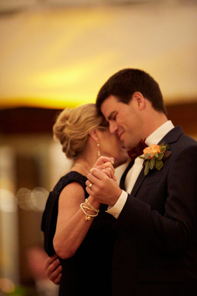 Photographing mother and groom dance