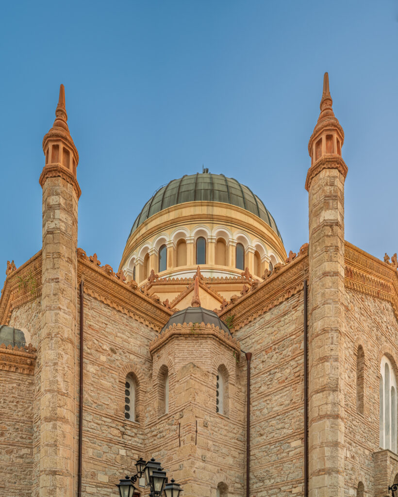 Rear architectural view showing the apse, dome and vertical massing