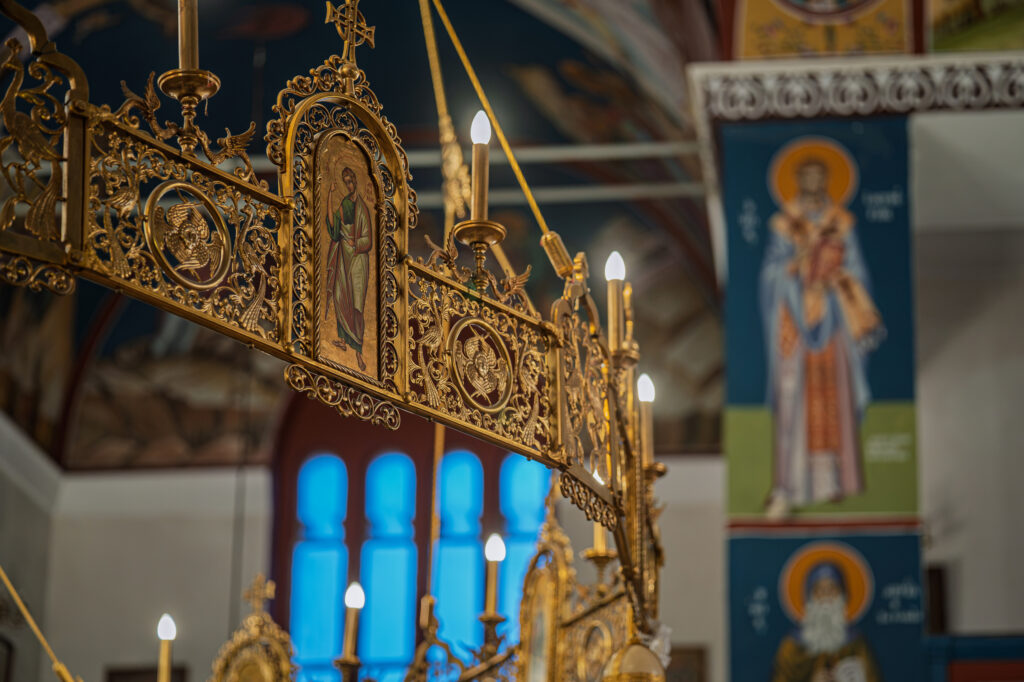 Icons and ornate decoration inside Panagia Faneromeni during the evening service.
