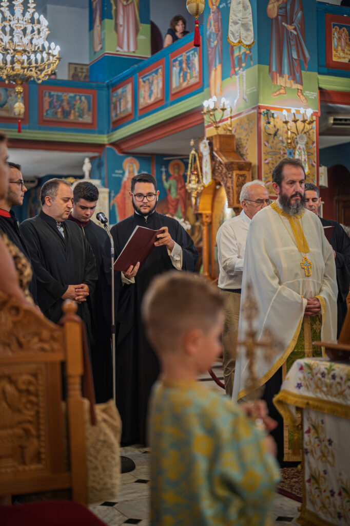 Clergy and chanters lead the Engomia service before the gathered congregation.